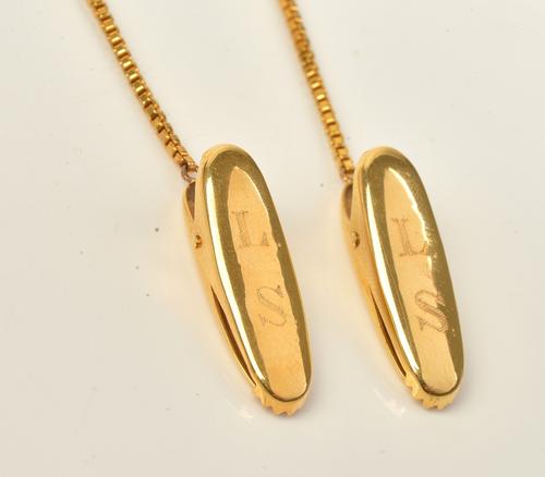 A gold box link chain fitted with an oval clip at each end, detailed 585, each oval clip initial engraved, gross weight 16.3gms.