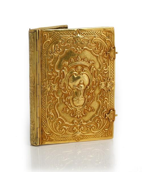 A gold mounted rectangular book binding, probably European 19th century, in the 18th century taste, the back and the front decorated with a central...