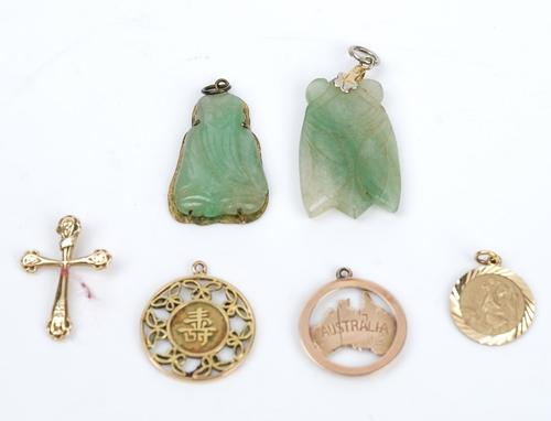 A 9ct gold St Christopher pendant, a gold pendant, designed as a map of Australia, detailed 9, a 9ct gold pendant cross, combined weight 4 gms and...