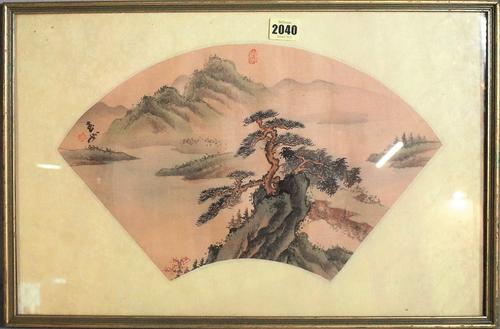 A Chinese fan painting, watercolour on silk, painted with a pine tree on a rocky outcrop before a mountainous river landscape, signed and with two...