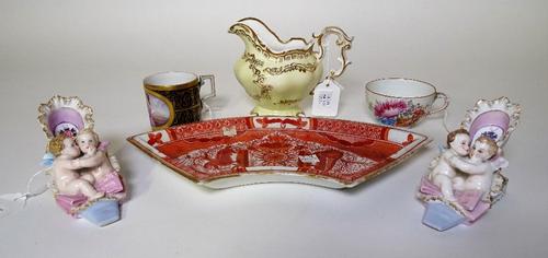 A Berlin porcelain cabinet cup painted with two women and a putto; a Meissen tea cup, Copeland & Garrett milk jug,an  English early 19th century...