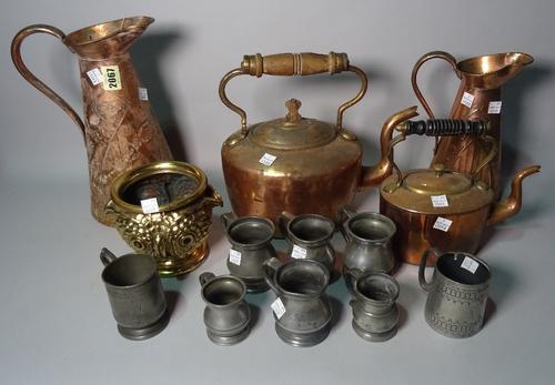 Metalware, comprising; two Art Nouveau copper jugs, the tallest 24cm high, an early 20th century brass vase, formed as an owl, 12cm high, and a group...