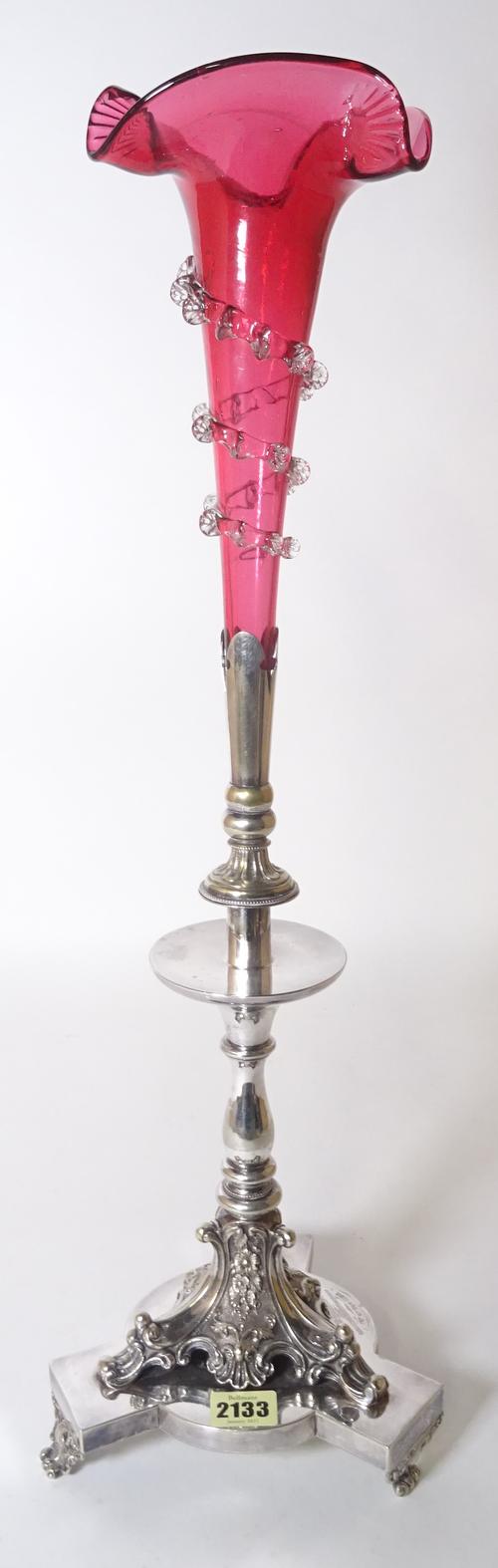 An early 20th century silver plated and ruby glass flower vase, 61cm high.