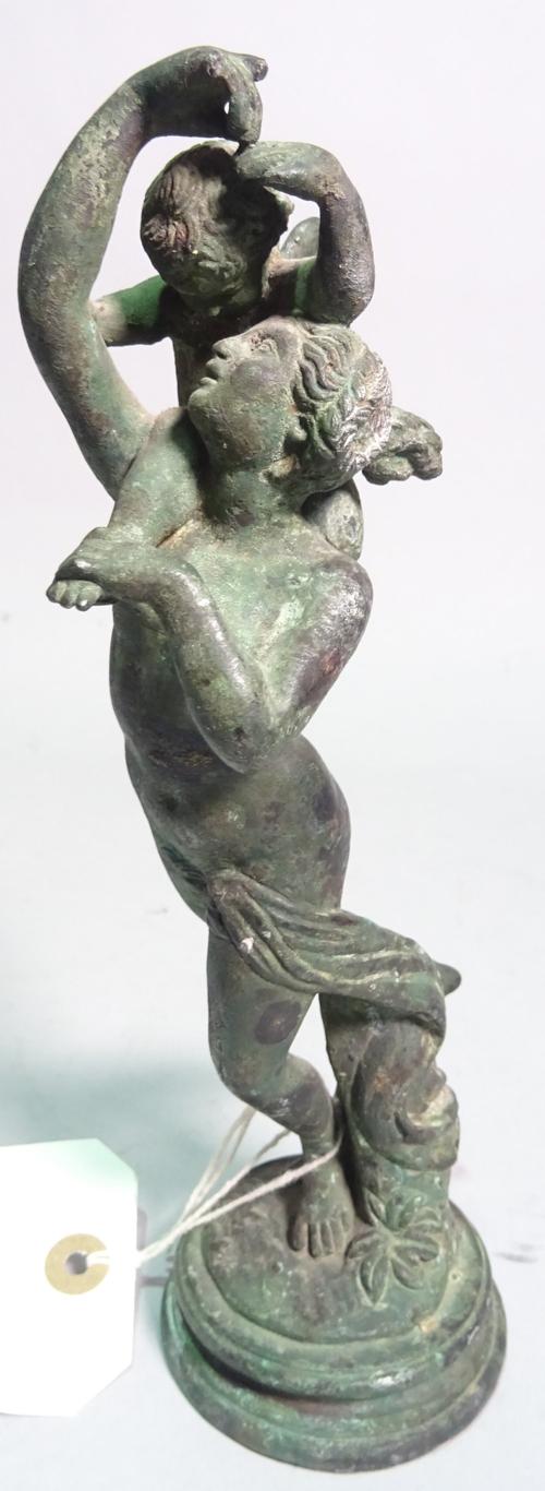 An early 20th century bronze figure of a female with a cherub, 22cm high.