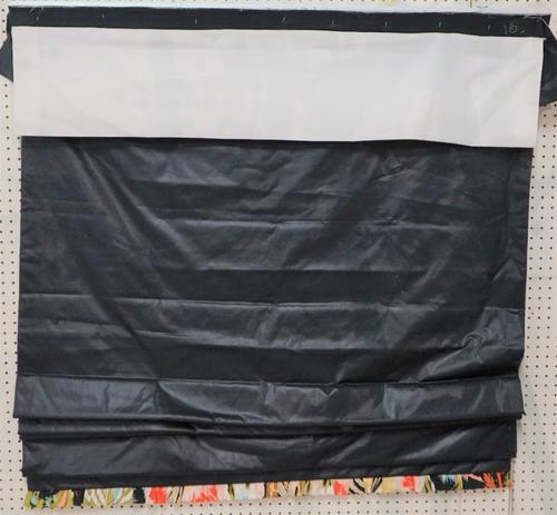 A Roman blind in dark blue with a colourful lower border, 125cm wide x 200cm long.