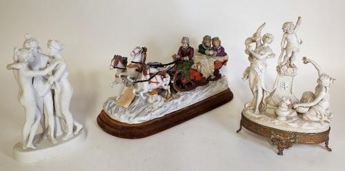 Ceramics, comprising; a continental figure of horses pulling a sleigh, 41cm long, a Bisque figure of The Three Graces, 26cm high, and another on a...