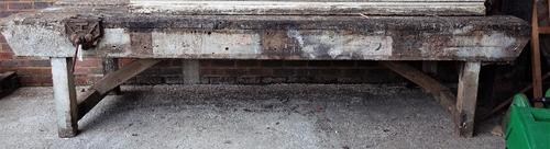 A 19th century hardwood work bench, 340cm wide x 85cm high.