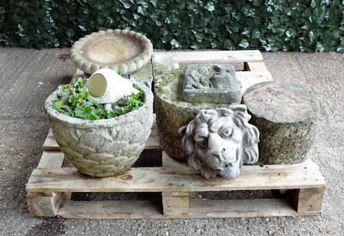 Garden statuary including a pair of early 20th century reconstituted stone wall hanging plaques, 20cm wide x 24cm high; a modern reconstituted stone...