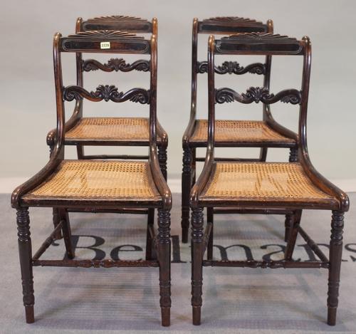 A set of four Victorian stained beech bar back dining chairs on turned supports, 43cm wide x 78cm high, (4).