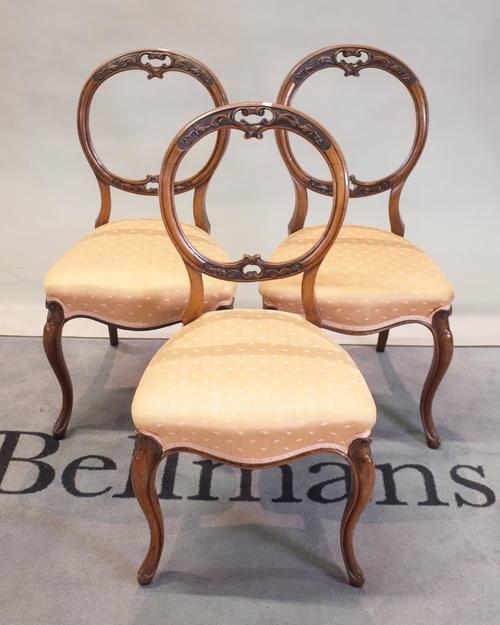 A set of six Victorian walnut balloon back dining chairs, 46cm wide x 90cm high, (6).