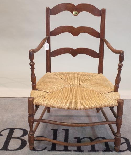 A late 19th century Continental elm and beech low ladderback open armchair, 60cm wide x 90cm high.
