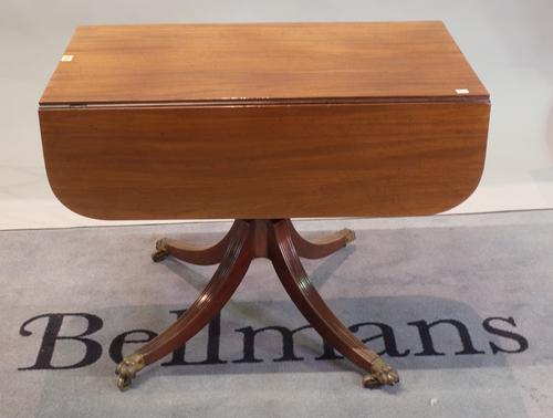 A Regency mahogany ebony banded supper table, with hinged drop leaves, end drawer, on a ring and baluster turned pillar and quadripartite base, 91cm...