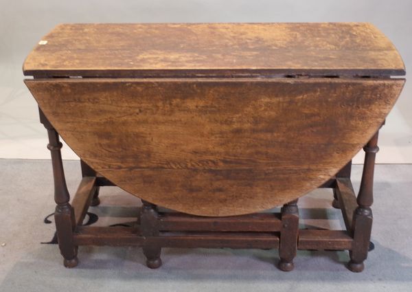 A late 18th century oak drop flap gateleg dining table, 116cm wide x 78cm high.
