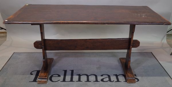 A 17th century style oak refectory table on slab supports, 68cm wide x 153cm long.