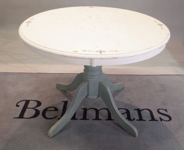 A modern painted pine circular dining table, with turned column, on four outswept supports, 100cm diameter x 74cm high.