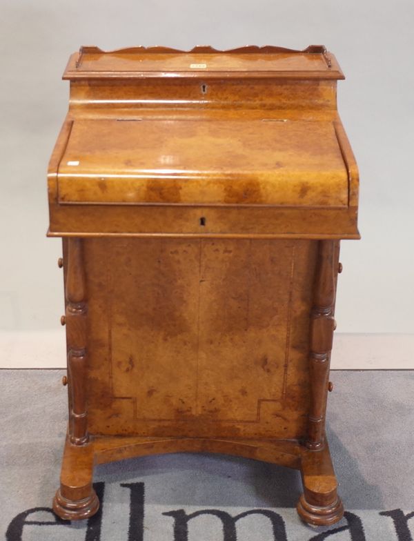 A late Victorian burr walnut Davenport, on bun feet, 54cm wide x 84cm high.