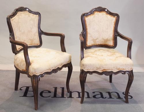 A pair of Louis XV stained beech open armchairs, 52cm wide x 95cm, (2).