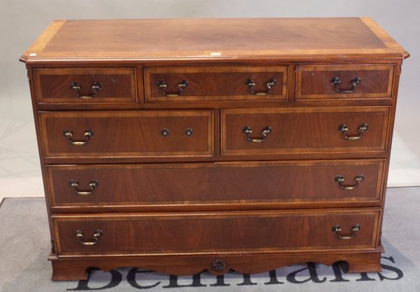 A modern mahogany chest with five short over two long drawers, on bracket feet, 125cm wide x 87cm high.