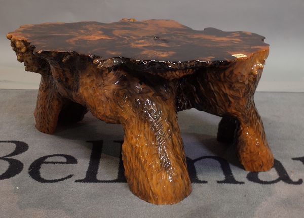 A painted resin root coffee table, 65cm wide x 40cm high.
