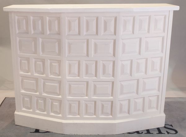 A white painted hardwood drinks bar with panel decoration, 136cm wide x 106cm high, and two matching bar stools, 58cm wide x 92cm high, (3).