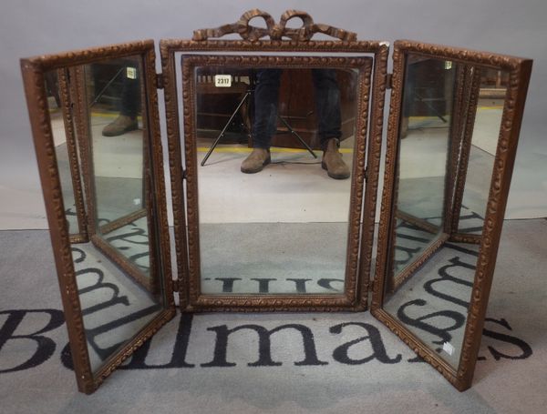 An 18th century style gilt gesso framed triptych mirror, 107cm wide x 70cm high.