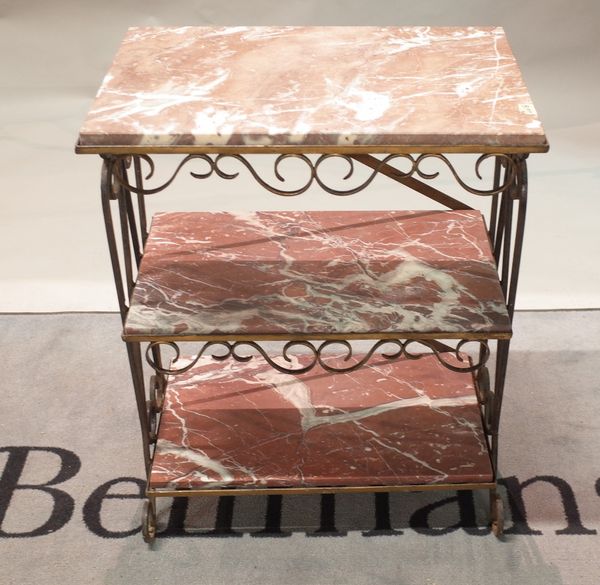 A gilded wrought metal rectangular three tier etagere, inset with rouge royal marble panels, 62cm wide x 79cm high.