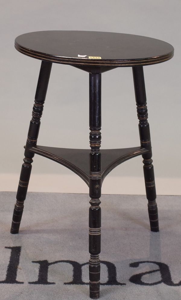 A late 19th century ebonised circular two tier occasional table, on turned supports, 46cm diameter x 65cm high.