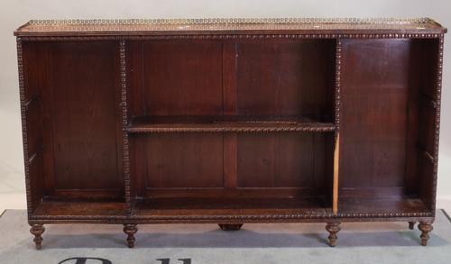A 19th century mahogany open bookcase with split beading decoration on turned supports , 165cm wide x 92cm high (a.f.).