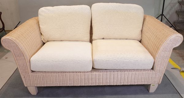 A wicker conservatory suite comprising; a sofa, 170cm wide x 70cm high, and two armchairs, 96cm wide x 71cm high, (3).