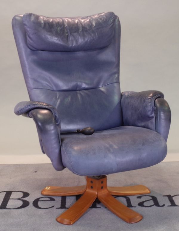 A 20th century hardwood framed low armchair with blue leather upholstery, 86cm wide x 105cm high.