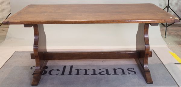 A 17th century style oak refectory table on dual ended supports, 84cm wide x 170cm long.