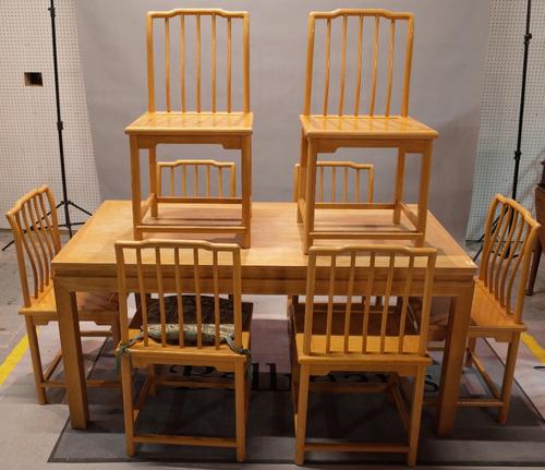 A modern Eastern design oak rectangular dining table, 80cm wide x 160cm long , together with a set of eight oak stick back chairs, 48cm wide x 91cm...