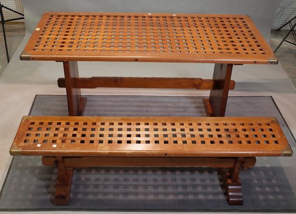 A campaign style brass bound teak rectangular dining table, 68cm wide x 155cm long, and three matching rectangular benches, 153cm wide x 46cm high,...