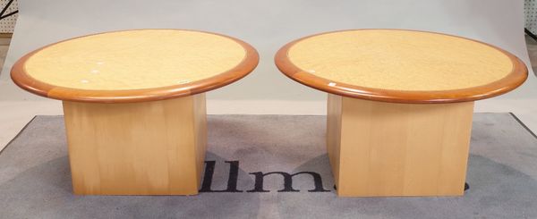 A pair of modern circular low occasional tables on square plinth bases, 80cm diameter x 40cm high, (2).