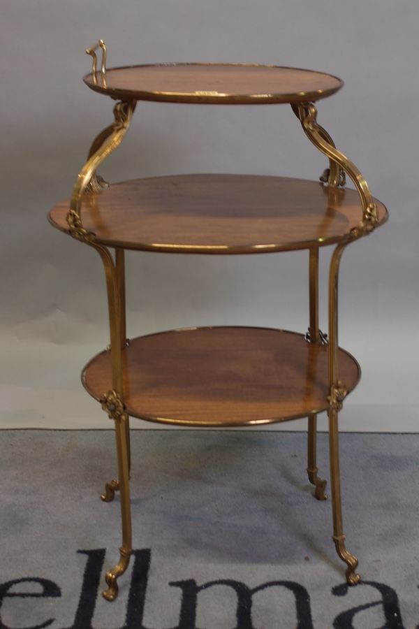 A 19th century Continental mahogany and gilt metal mounted three tier etagere, 55cm wide x 90cm high.
