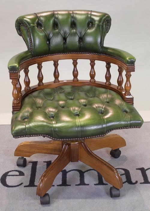 A modern stained beech office open armchair with green leather buttonback upholstery, 62cm wide x 91cm high.
