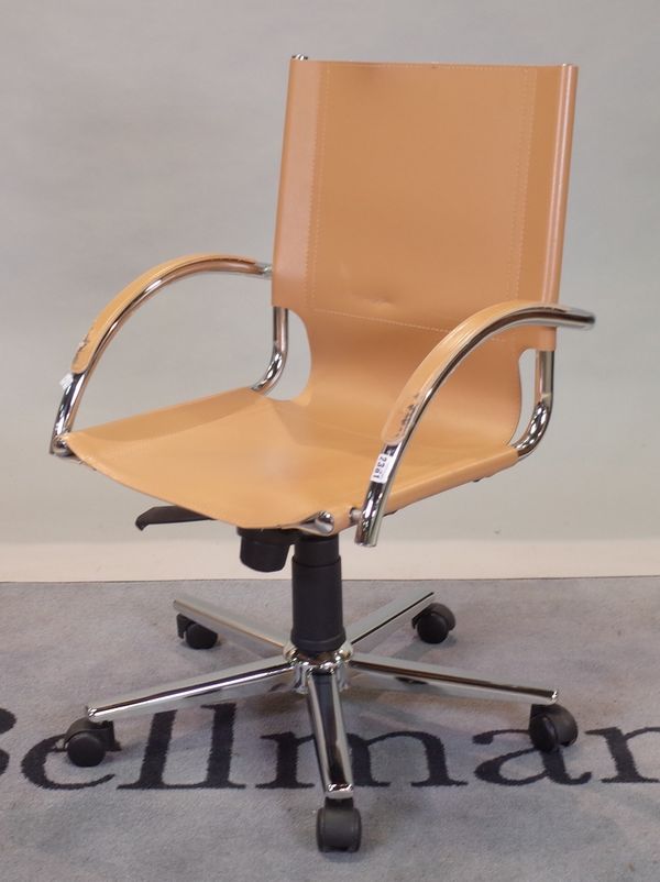 A modern tan leather and chrome office open armchair, 56cm wide x 89cm high.