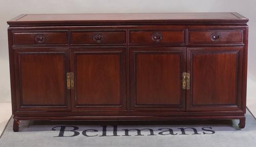 A modern Chinese hardwood sideboard with four drawers over cupboard base, 185cm wide x 90cm high.