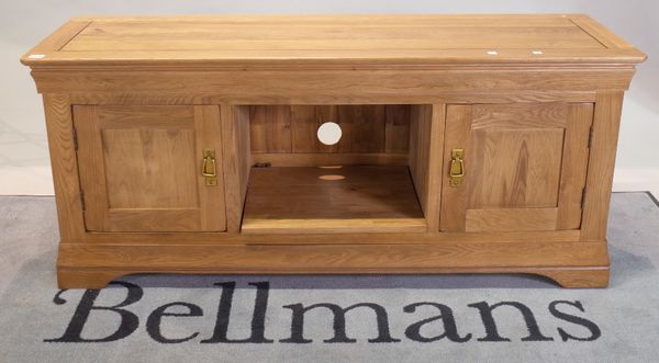 A modern oak low side cupboard, 140cm wide x 60cm high.