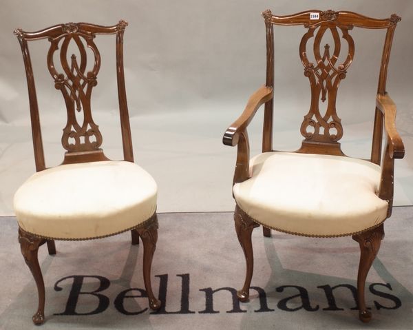 A set of nine George II style mahogany dining chairs with pierced shaped splats and shell carved cabriole supports, 50cm wide x 100cm tall, (9).