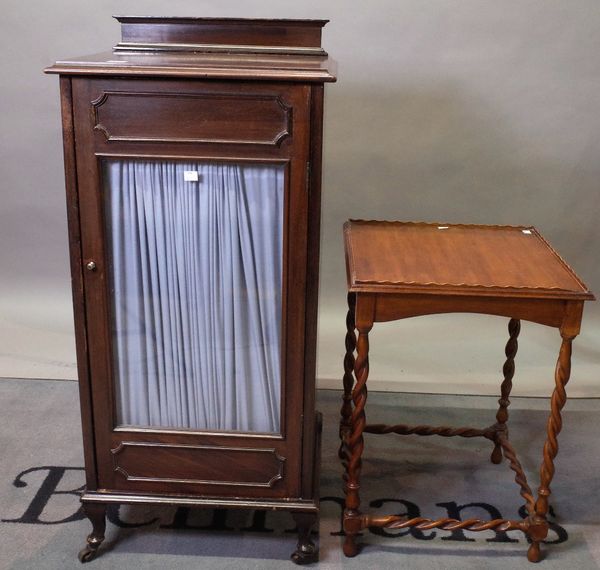 An Edwardian mahogany music cabinet, with single glazed door, 49cm wide x 106cm high and a reproduction 17th century style mahogany table, on...