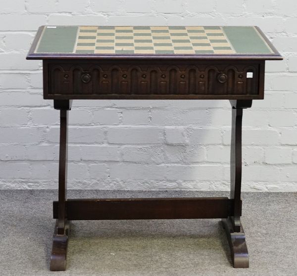 A Tower of London, oak chess table, (lacking chess pieces), 81cm wide x 75cm high x 55cm deep.
