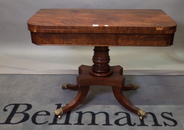 A Regency mahogany D-shaped card table on oval turned column and four downswept supports, 91cm wide x 70cm high.