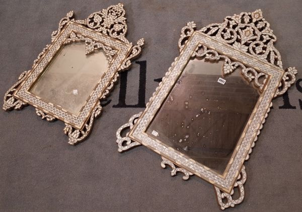 A Syrian bone and mother-of-pearl mounted upright wall mirror, 20th century, with pierced foliate surmount, 92cm high x 55cm wide and a smaller...