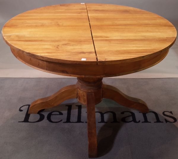A 19th century French style circular extending dining table with extra leaf, 120cm diameter x 170cm long extended.