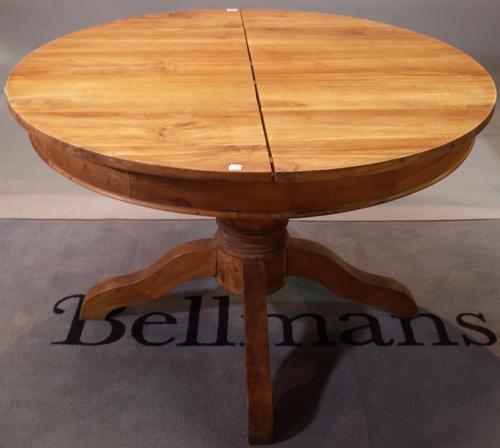 A 19th century French style circular extending dining table with extra leaf, 120cm diameter x 170cm long extended.