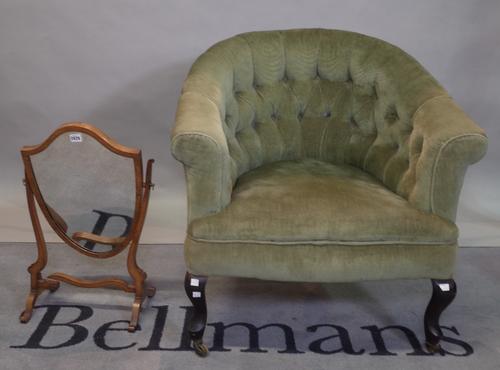 An Edwardian button down upholstered tub back armchair, on cabriole legs and a mahogany frame toilet mirror, 75cm wide x 80cm high, (2).