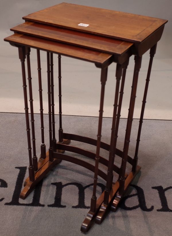 A nest of three Regency style mahogany tables, late 19th century, with burr walnut crossbanded boxwood and ebony strung rectangular tops, the largest...
