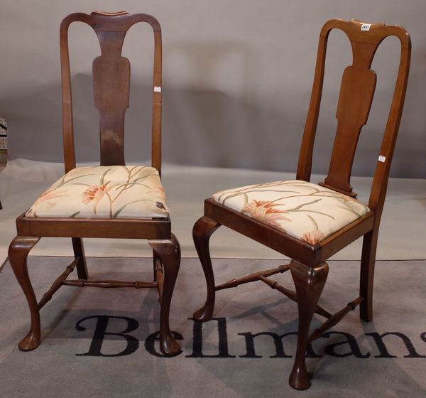 A set of four George I style walnut dining chairs, with solid vase splat backs, drop-in seats, on cabriole legs, 47cm wide x 102cm high (4).