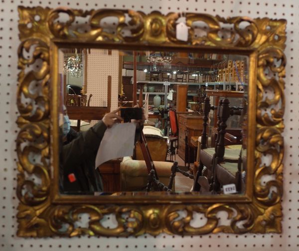 An 18th century style Florentine giltwood frame rectangular wall mirror, with leaf scroll carved and pierced border, 72cm wide x 60cm deep.